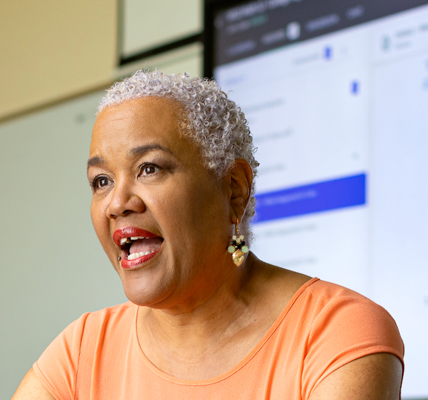 Prof. Donna Smith teaching with Promethean Board in the Background